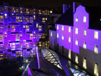MSP building and Queensberry House at night